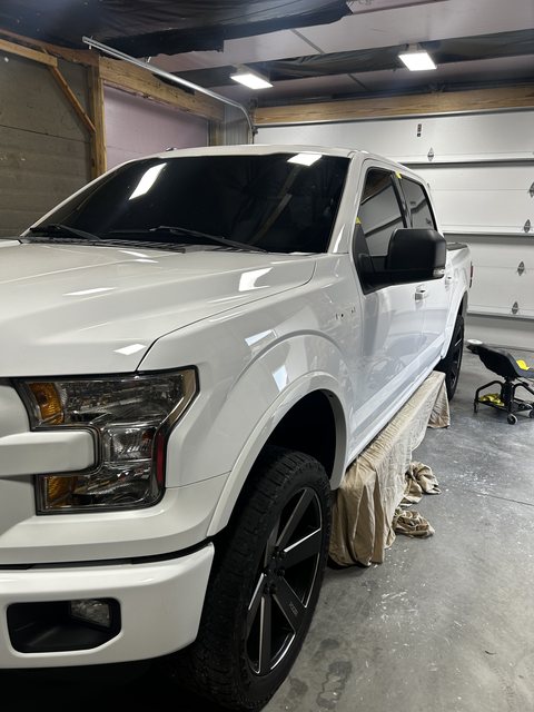 White Ford F-150 with ceramic coated paint inside the shop