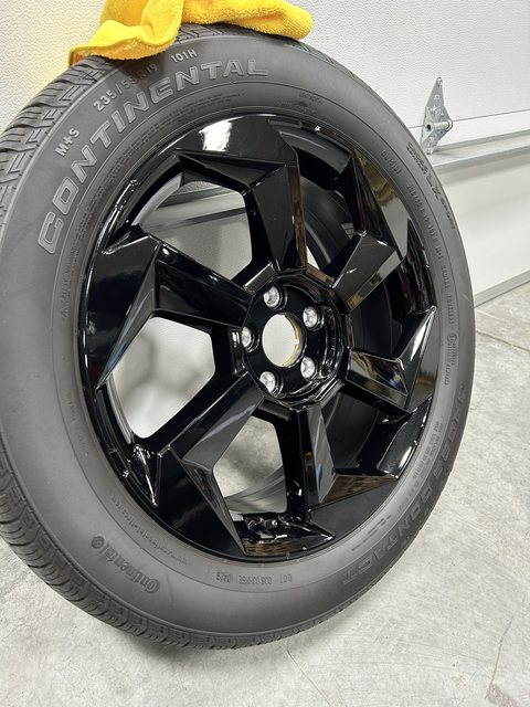 Gloss black wheel with a ceramic coating, mounted on a Continental tire